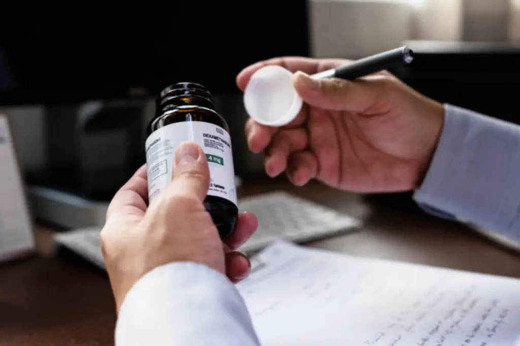 A professional reviewing a pharmaceutical bottle and technical documentation, representing our translation services for labeling and protocols.